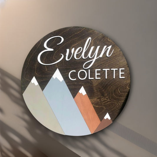 wooden name sign for nursery with minimal mountains