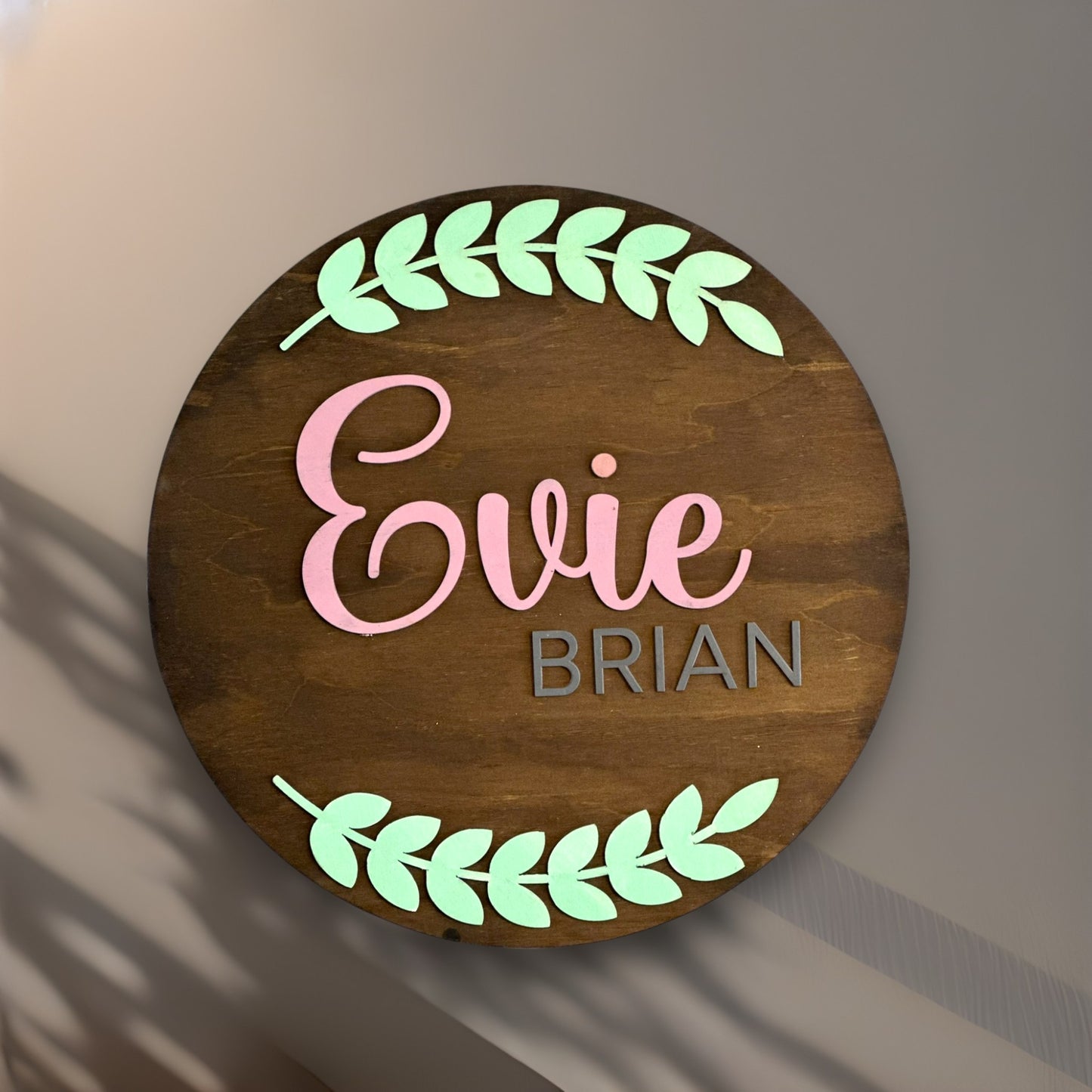 Personalized round wood sign for baby’s nursery/kid’s room with first+middle name and wreath