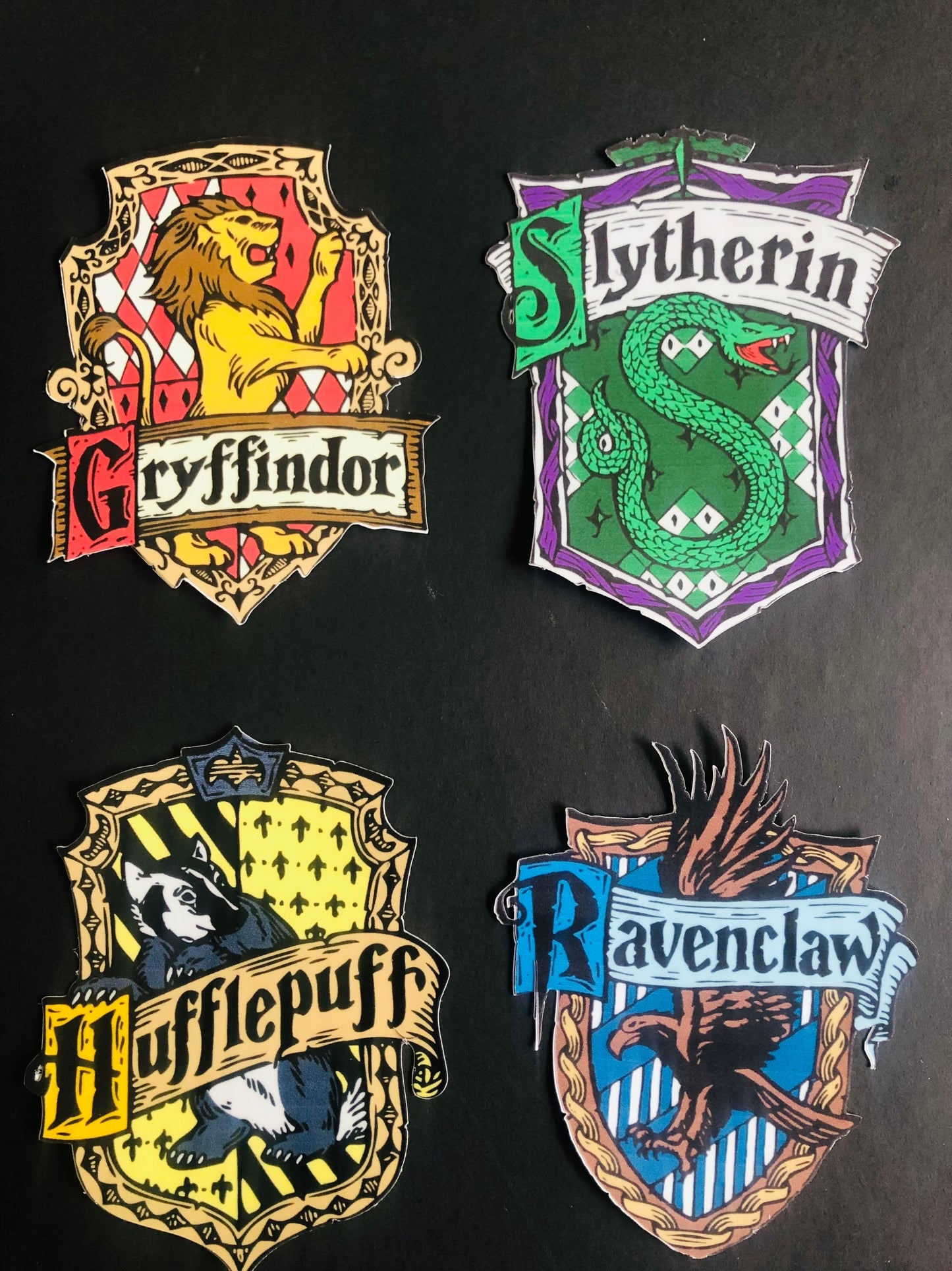 School of wizardry houses stickers, laptop stickers, luggage stickers, snake emblem, raven sigil, badger shield, lion emblem